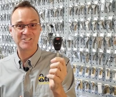 A chipped car key that needs to be cut and programmed when all keys are lost